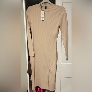 Never worn still has tags Bebe dress.